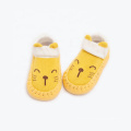 Calcetines antideslizantes de los zapatos del piso del niño de la historieta de los niños del bebé de la suela de cuero